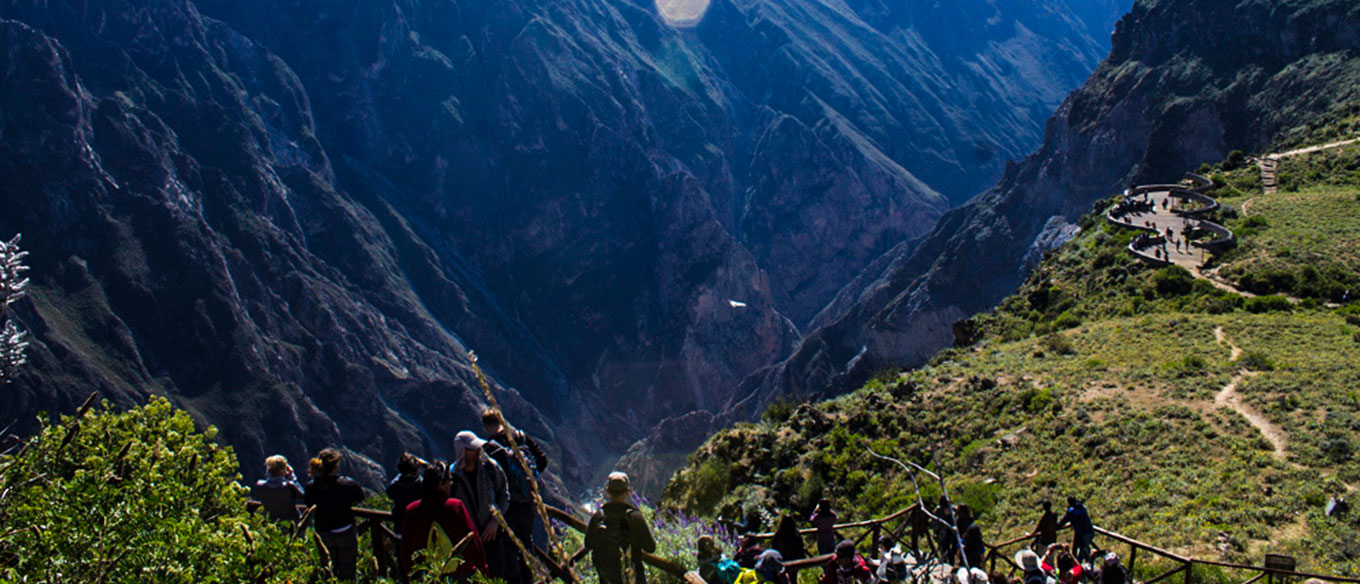 Hot springs in the Colca Canyon with mountains in the background.